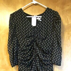 Flowy black and white dress with ruched front.  Super cute!